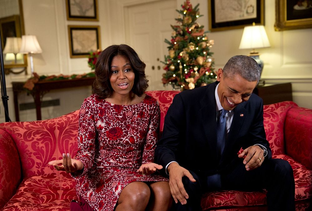 Obama busting out in laughter as he and Mrs. Obama recorded a holiday video message in the Map Room of the White House.