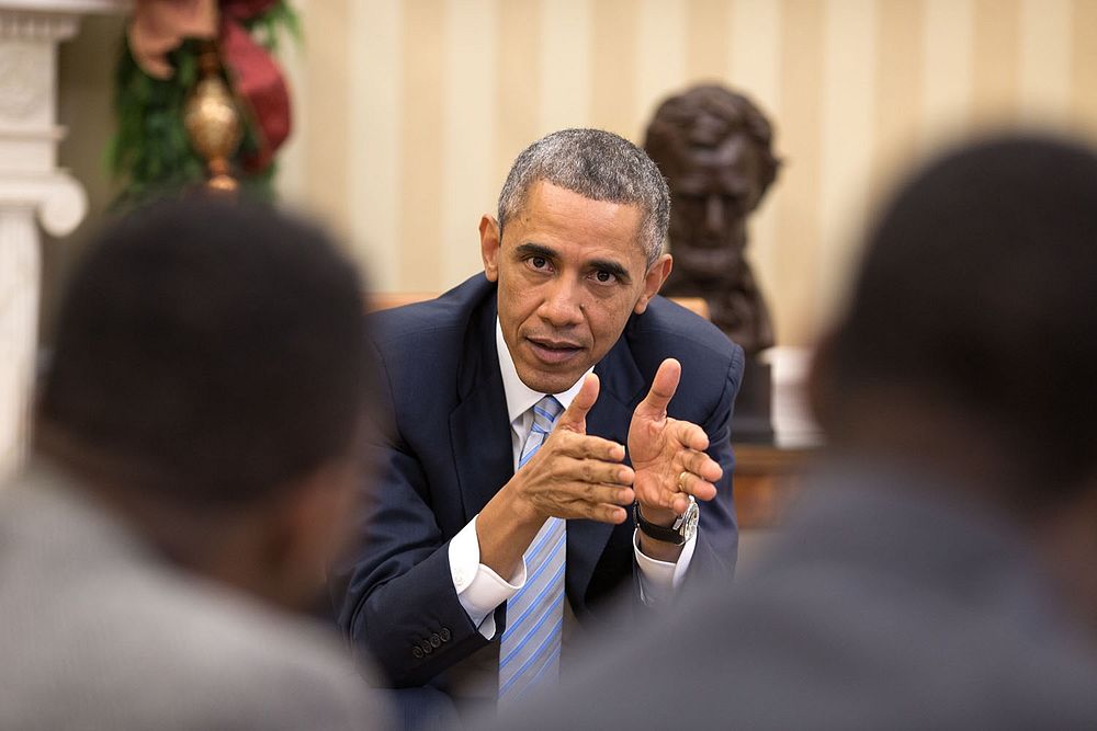President Barack Obama meets with young local and national civil rights leaders in the Oval Office, Dec. 1, 2014.