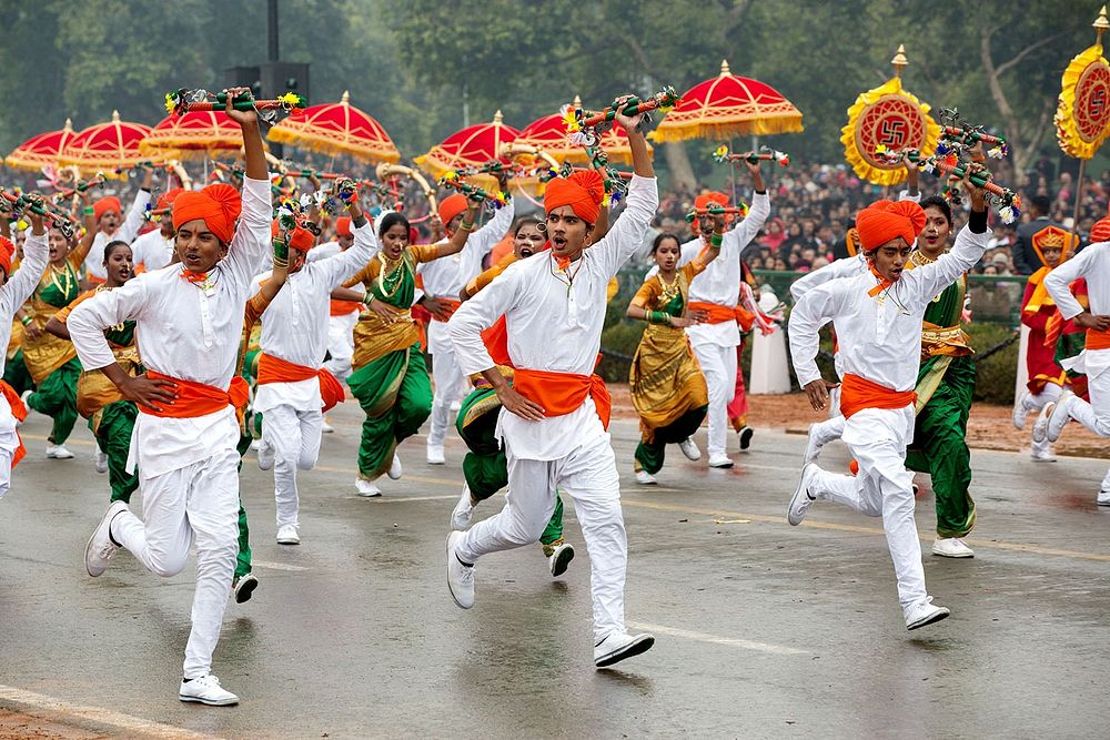 Entertainers pass by the reviewing stand during the Republic Day Parade in New Delhi, India, Jan. 26, 2015.