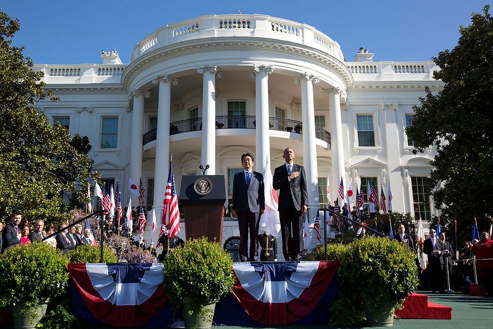 President Barack Obama and Prime Minister Shinzo Abe of Japan listen to the U.S. national anthem during the State Arrival…