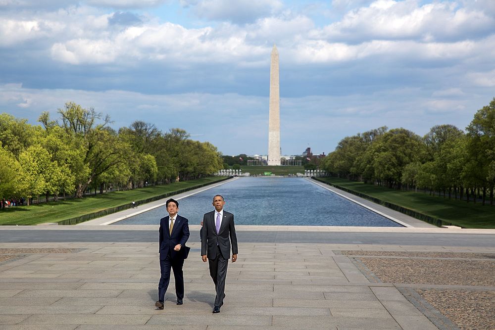 President Barack Obama and Prime Minister Shinzo Abe of Japan walk from the Reflecting Pool toward the Lincoln Memorial in…