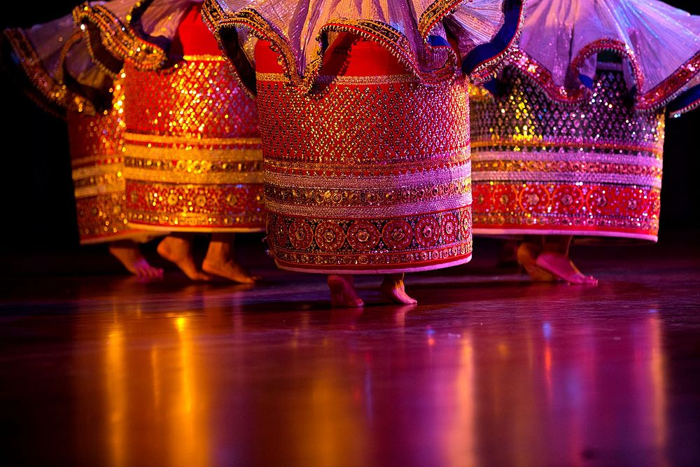 Dancers perform during a cultural performance in India. Original public domain image from Flickr