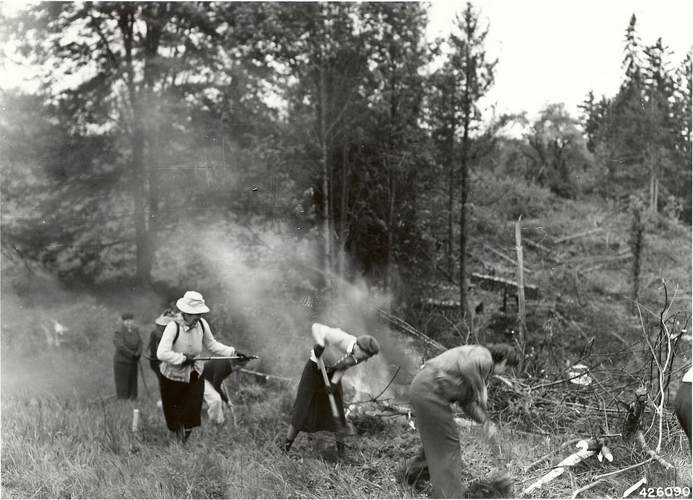 Women's Forest Service Reserve building a practice fire around a small slash fire, 1945Deschutes National Forest Historic…