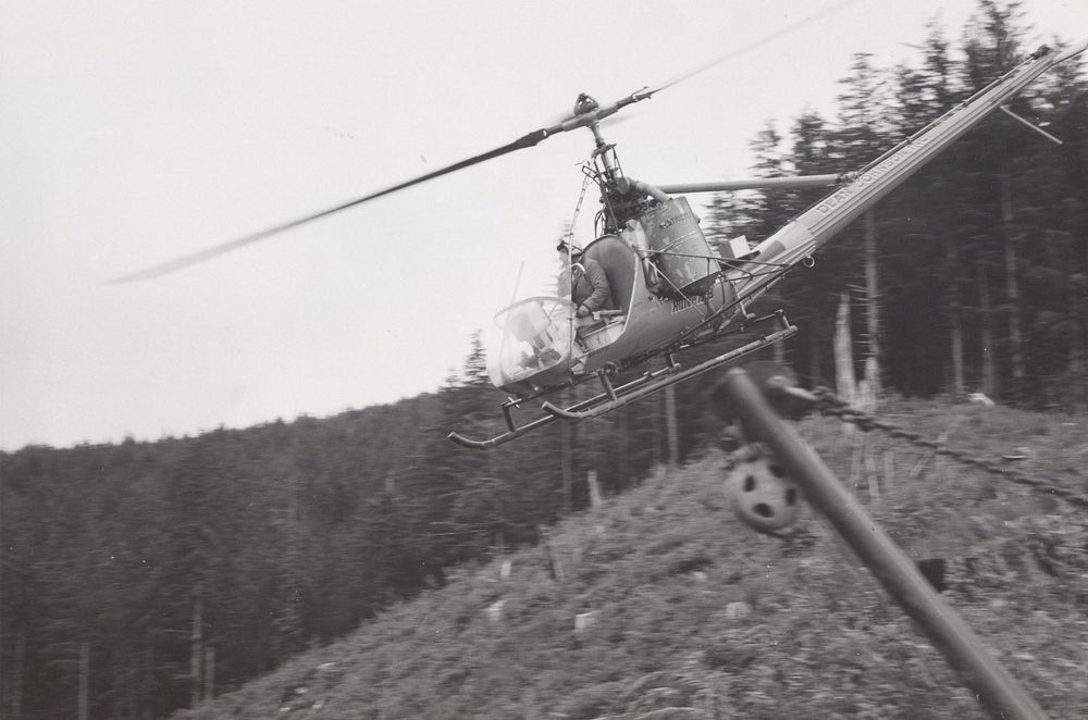 Helicopter loggingSiuslaw National Forest Historic Photos. Original public domain image from Flickr