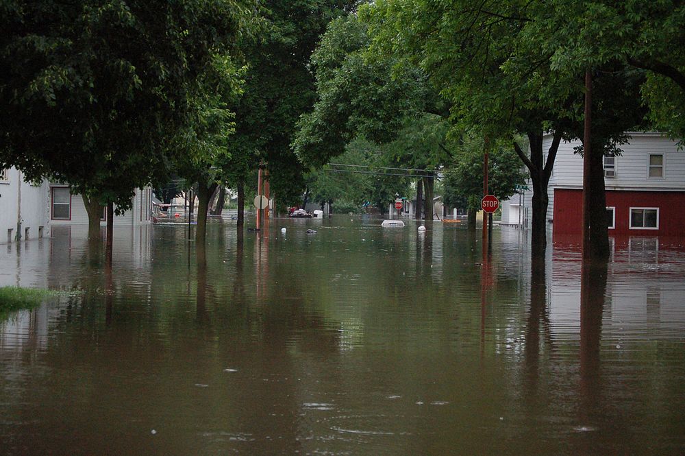 Flooded street in Cedar Rapids, IA near 13th Ave. and J Street (photography: Don Becker, USGS). Original public domain image…
