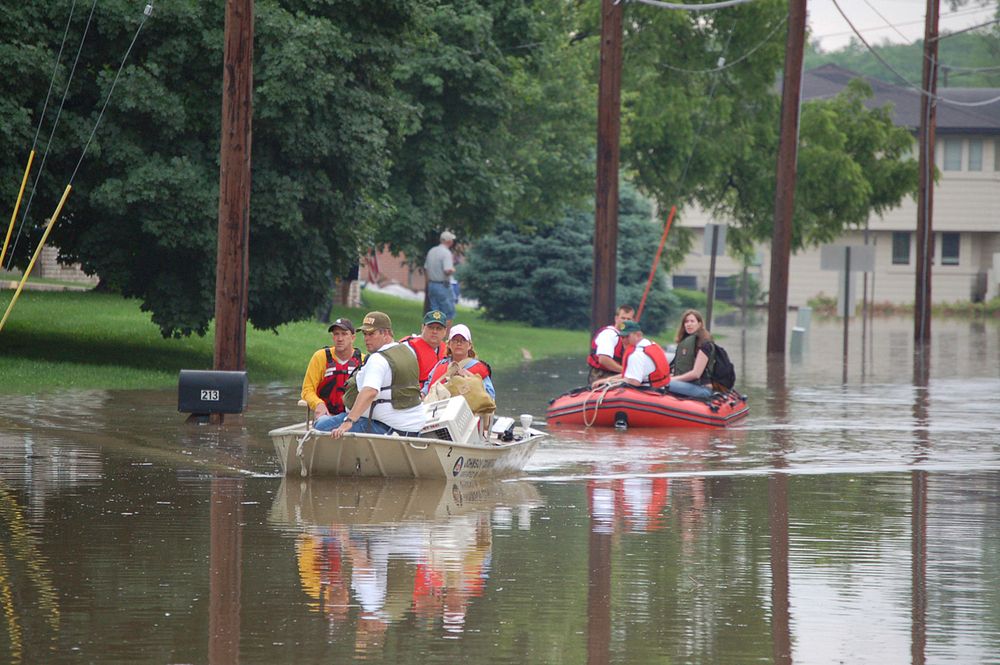 Rescued Flood Victims, Coralville, IARescuing victims in Coralville, IA (photography: Don Becker, USGS). Original public…