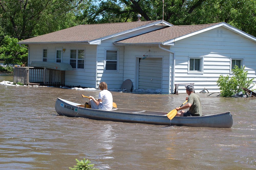 Local residents canoing through a neighborhoodLocal residents canoing through a neighborhood in Finchfield, IA (photography:…