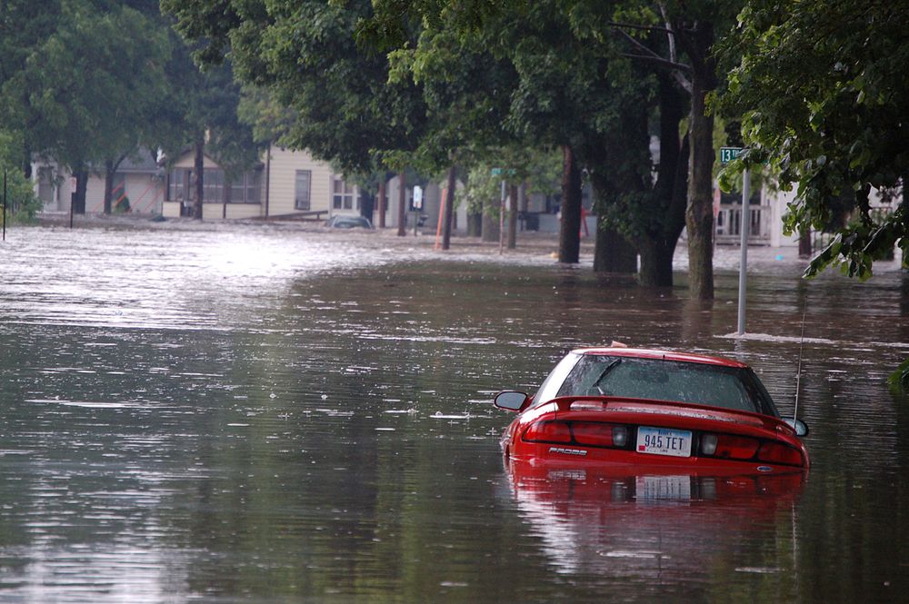 Flooding in Cedar Rapids, IAFlooded street in Cedar Rapids, IA near 13th Ave. and J Street . Original public domain image…