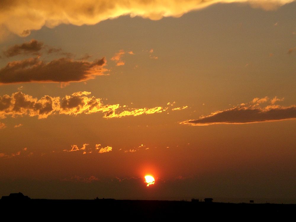 Sunset with sun in the clouds_Bozeman, MT 7/23/2008. Original public domain image from Flickr