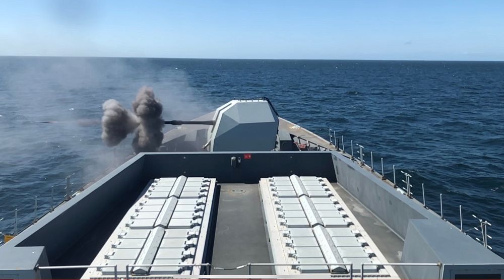 Royal Navy Daring-class destroyer HMS Defender firing her 4.5" Mk8 Mod 1 Gun in the Atlantic Ocean.