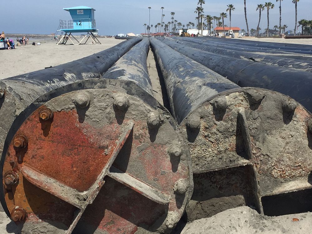 This close-up view of the sections of high-density polyethylene, or HDPE, pipe shows the flanges Manson will use to connect…