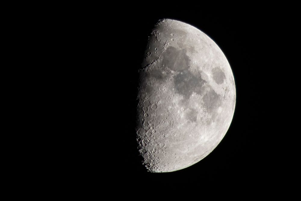 Half moon on black background. Original public domain image from Flickr