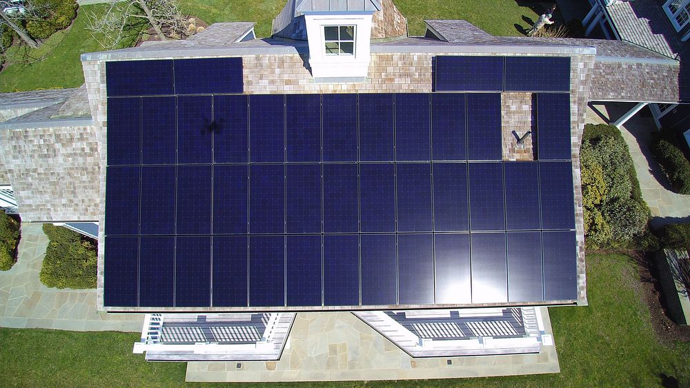 This stunning shot of SunPower photo-voltaic panels on a majestic Dennis, MA home was taken by Todd Druskat, solar expert…