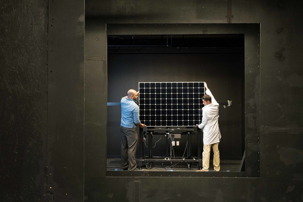 Alliston Watts and Andrew Mani mount a PV module for IV performance testing in Fraunhofer CSE&rsquo;s solar simulator dark…