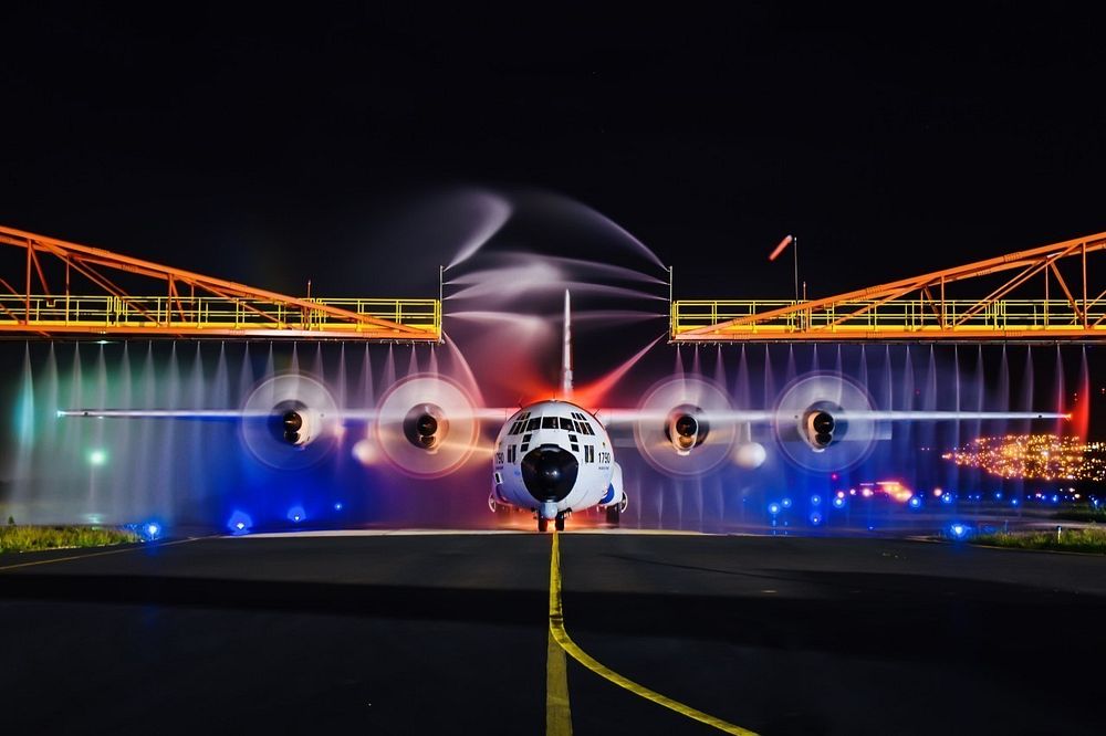A Coast Guard HC-130 Hercules airplane gets rinsed down at Air Station Barbers Point, Jan. 24, 2018.
