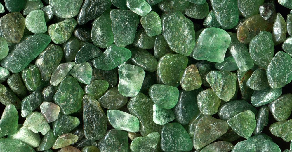 Green stones texture background, pebbles pile 