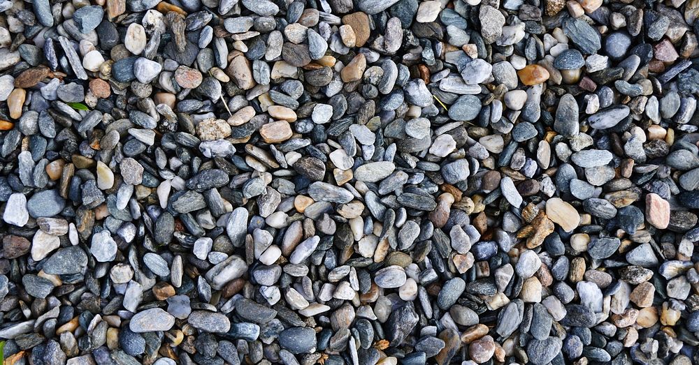 Pebbles pile texture background, stone pattern