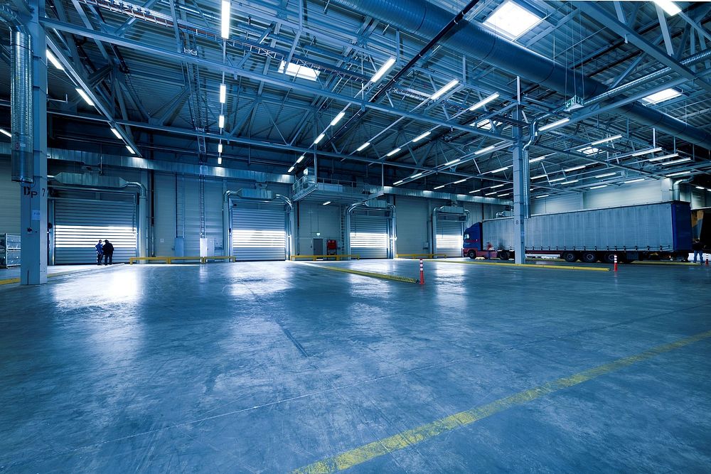 Large warehouse with truck. Free public domain CC0 photo.