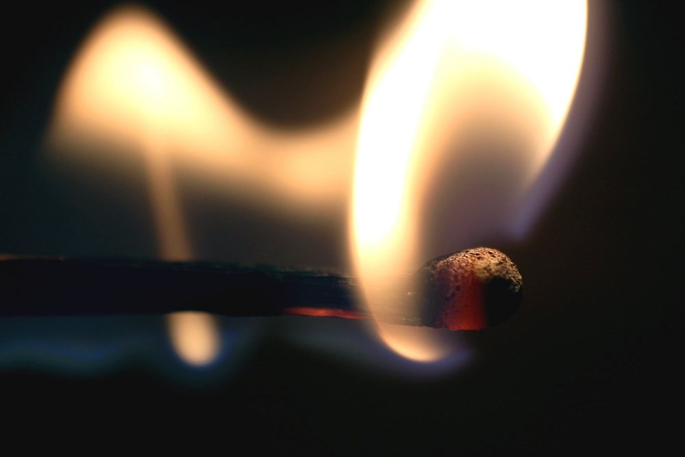 Flame on matching stick. Free public domain CC0 photo.