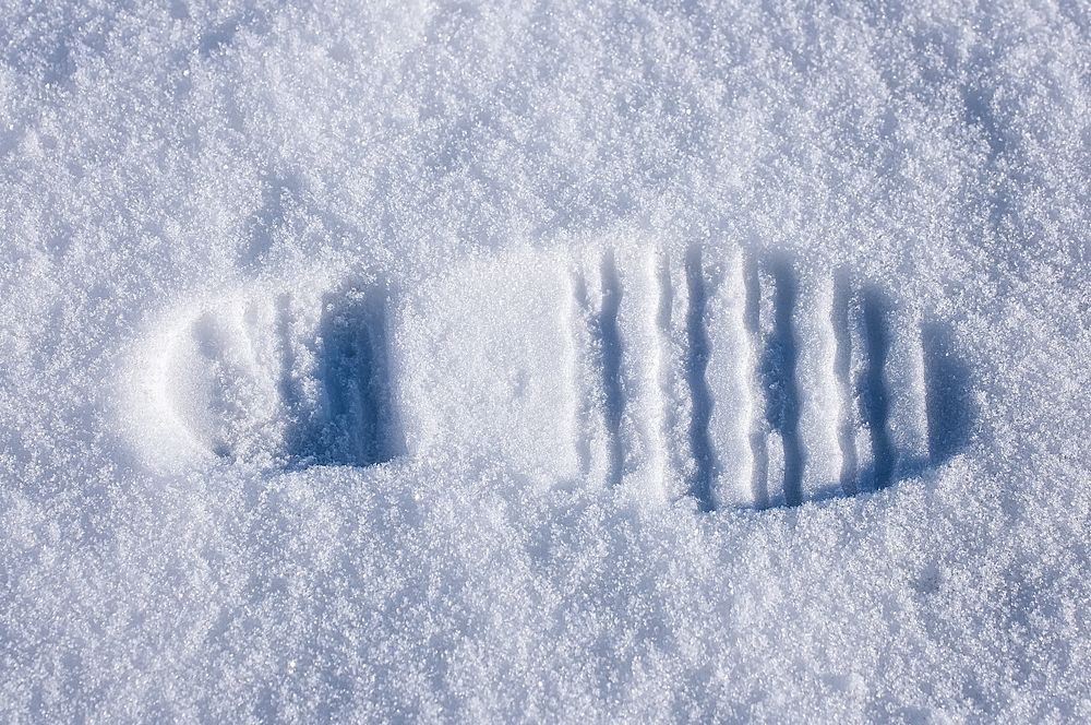 Footprint on the snow. Free public domain CC0 photo