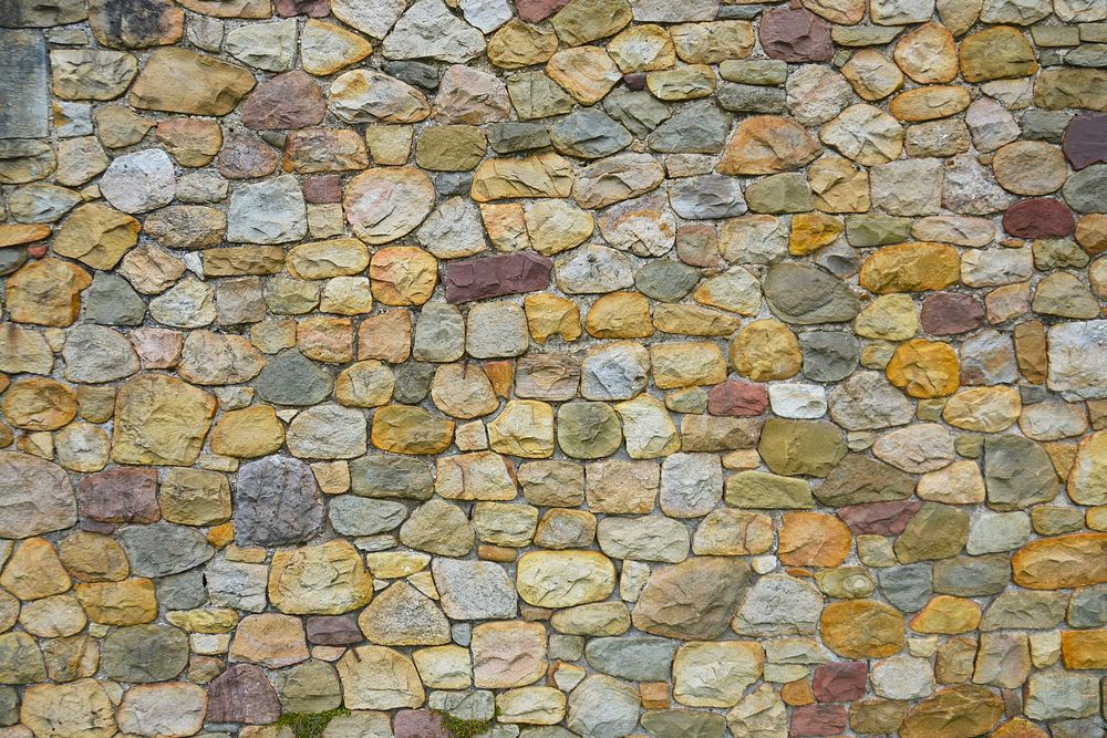 Cobblestones wall texture background, close up design