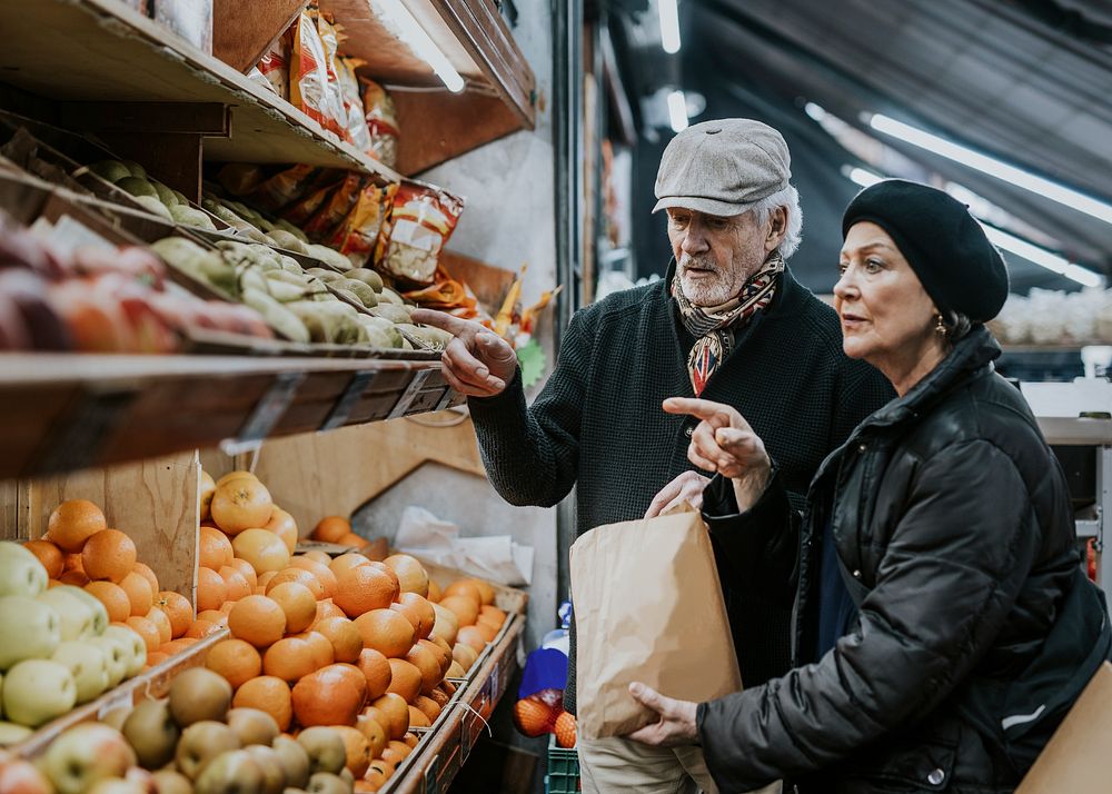Couple buying fruits at market