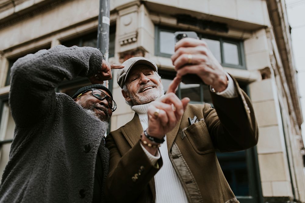 Senior men taking selfie in the city