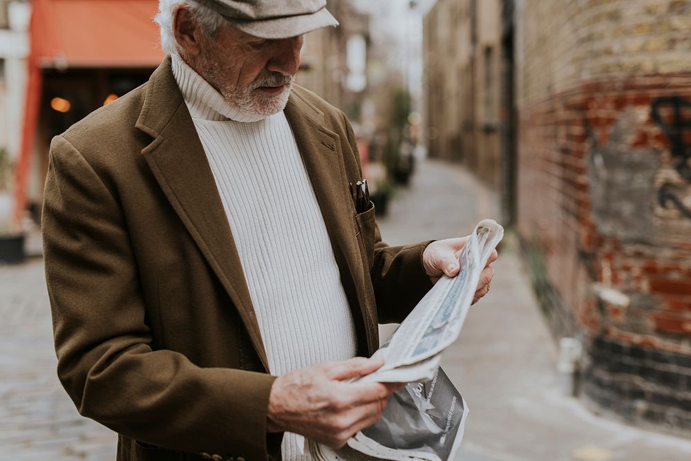 Old man reading the news