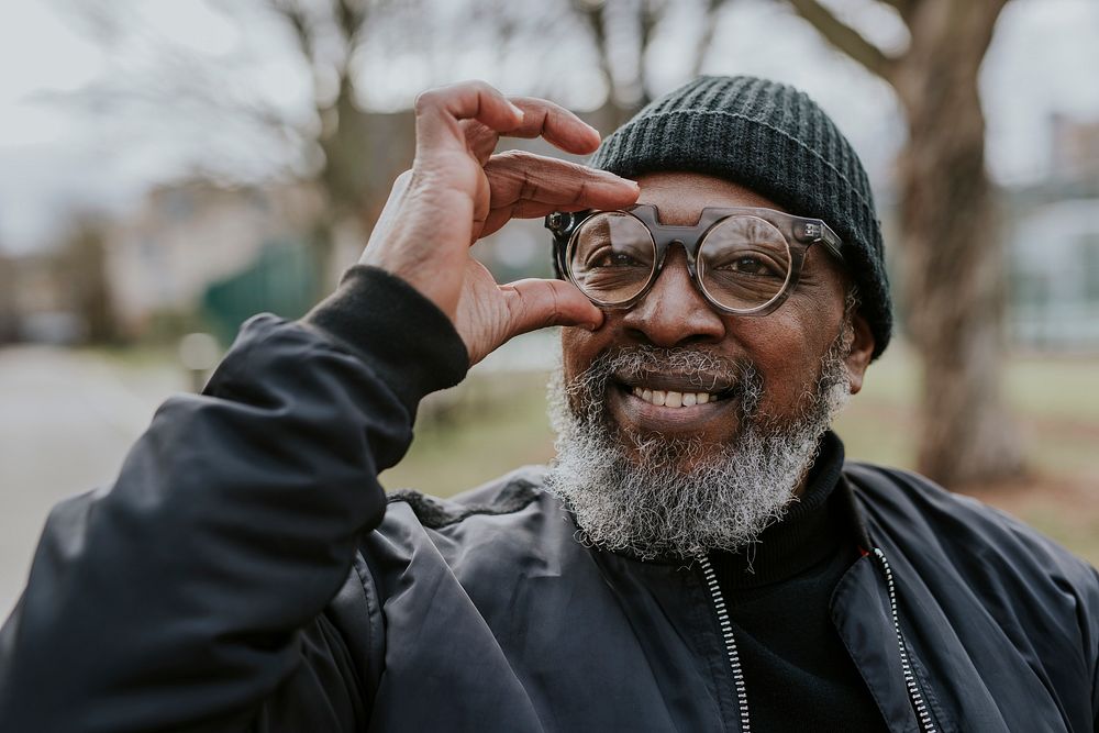 Stylish senior guy with trendy glasses