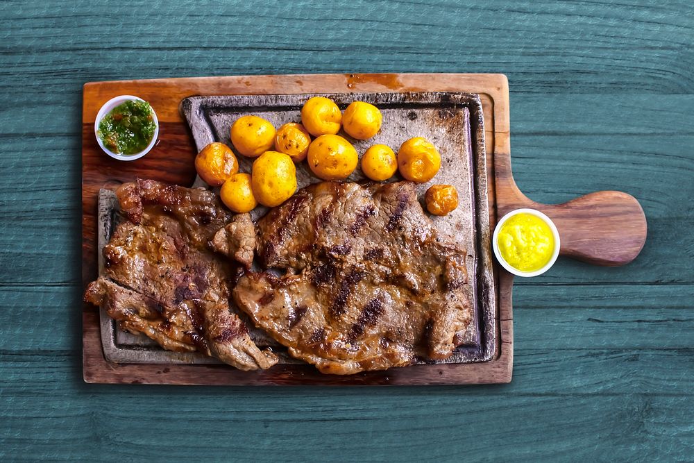 Steak on wooden platter, food | Free Photo - rawpixel