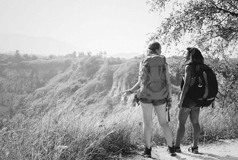 Young backpackers traveling in nature