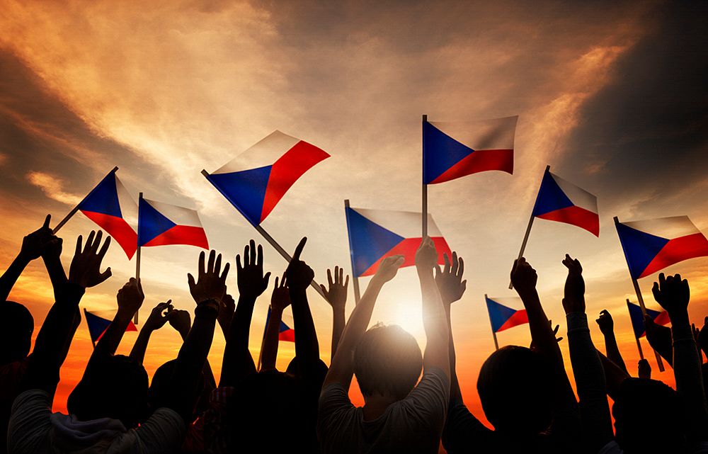 Silhouettes of People Holding the Flag of Philippines