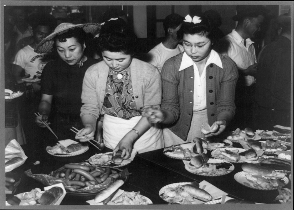 San Juan Bautista, California. Japanese-American girls preparing picnic lunch by Russell Lee