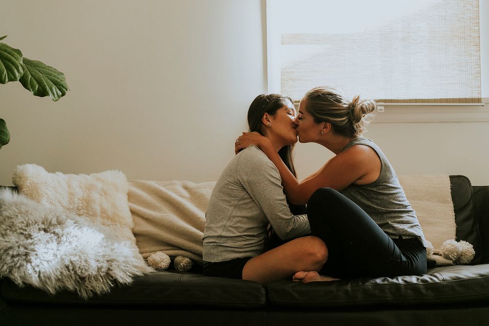 Sweet lesbian couple on the sofa