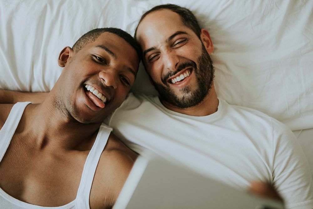 Couple taking a selfie in bed
