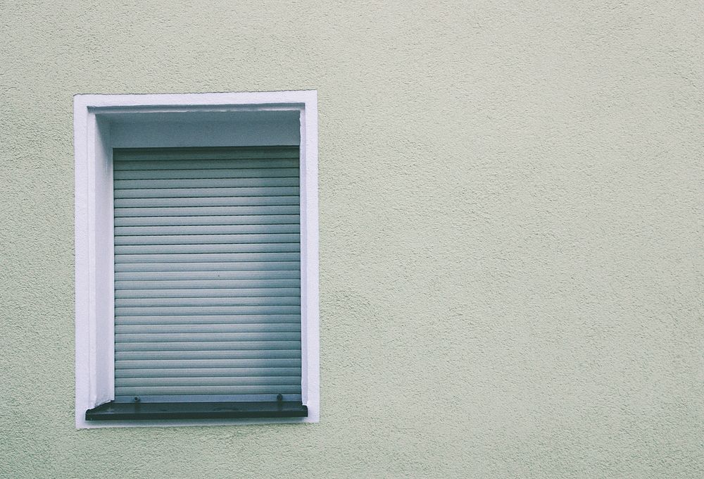 House window with closed blinds