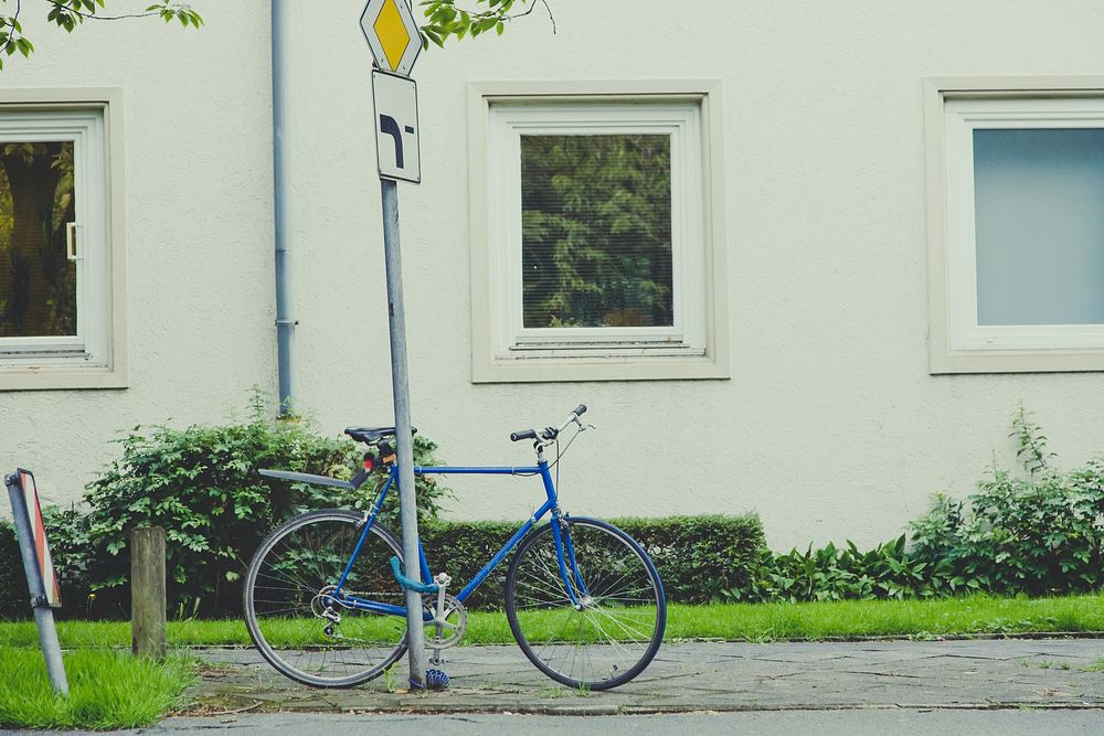 Bike chained to a street sign