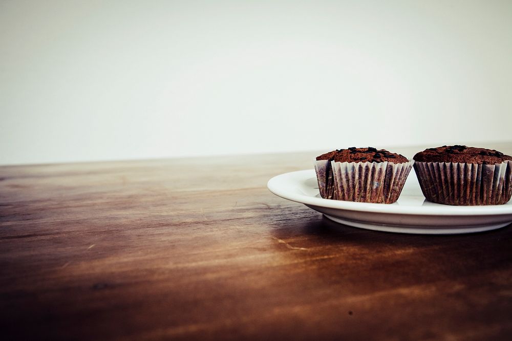 Homemade chocolate cupcakes on wooden table
