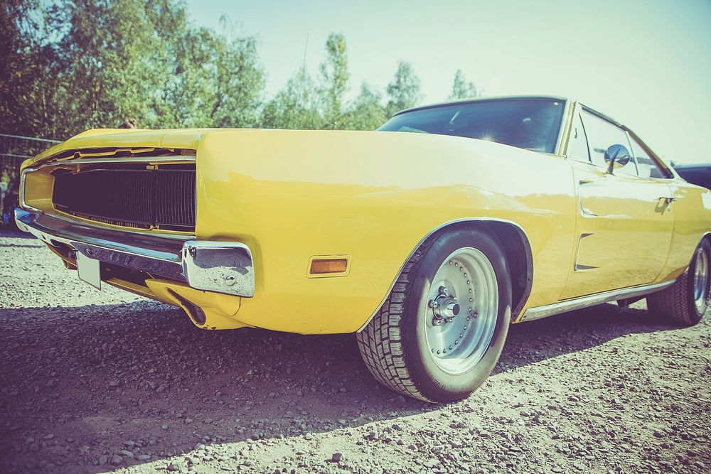 Close up of a vintage yellow car