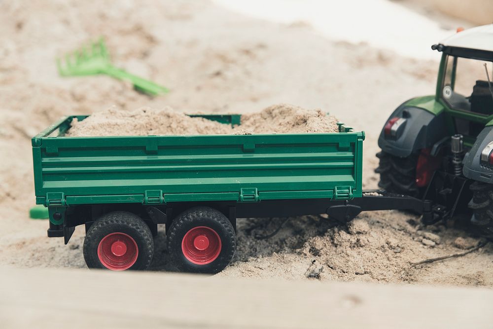 Tractor and a trailer in a sandbox