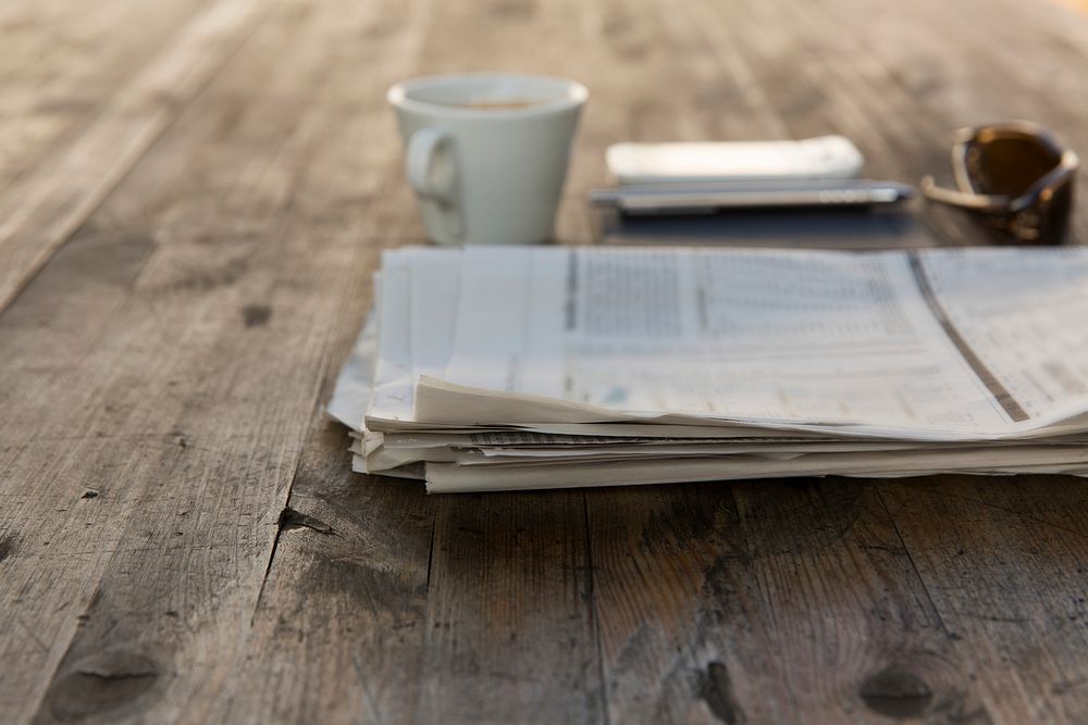 Cup of coffee and a newspaper