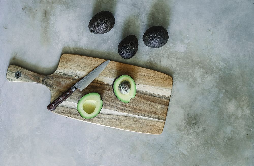 Avocado on a wooden chopping board