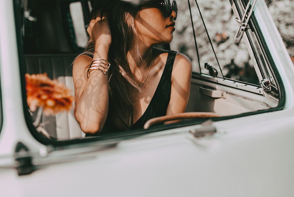 Aesthetic woman road trip portrait, travel influencer in a van