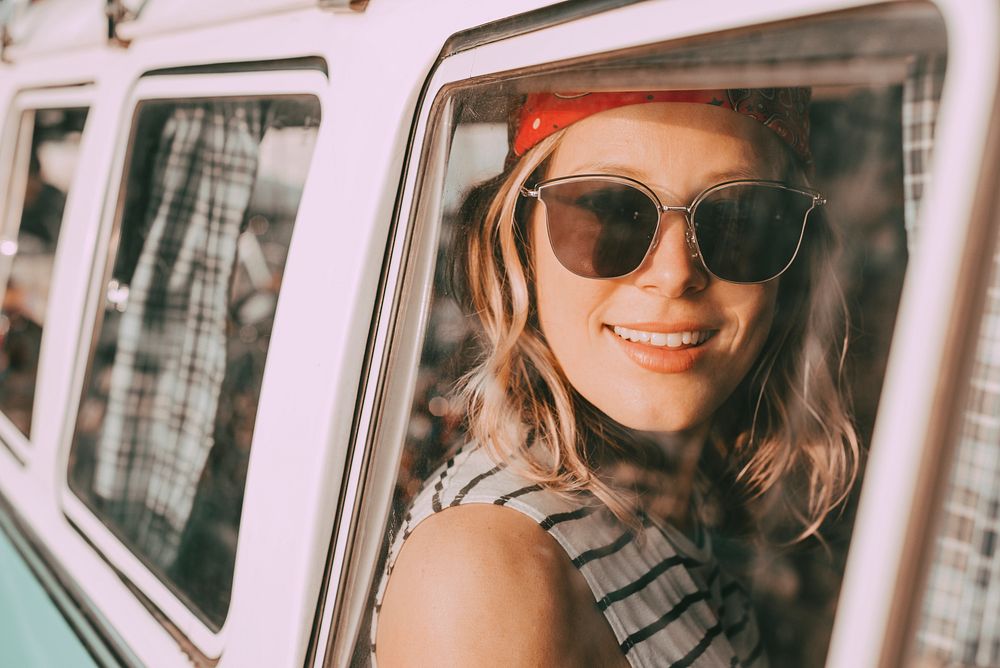 Smiling woman portrait, road trip travel photo in aesthetic style