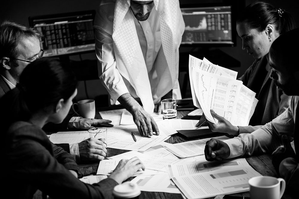 Group of entrepreneur analysing for investment in meeting room