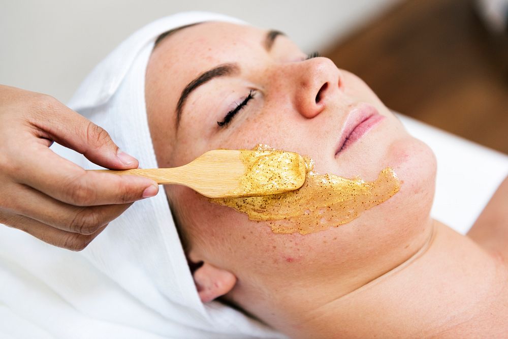 Woman relaxing with facial treatment