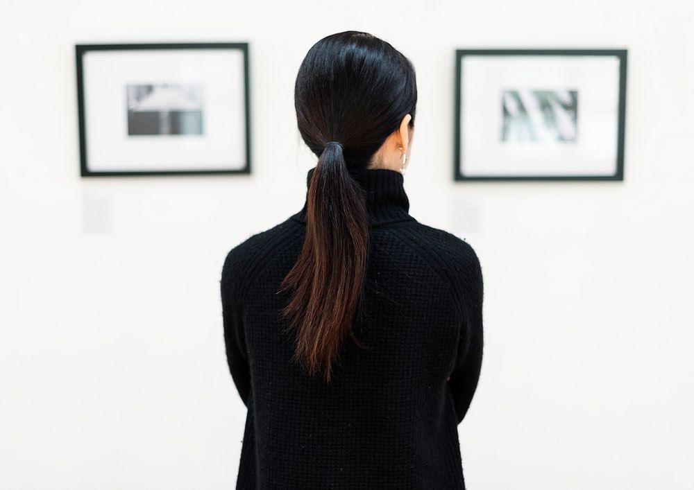 A woman is joining an art exhibition