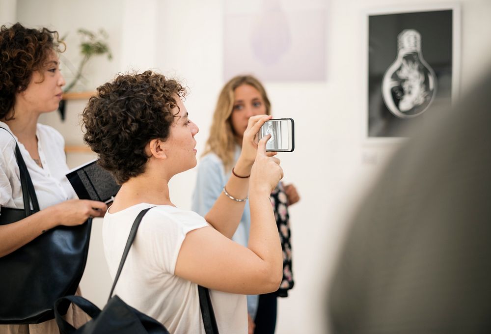 People attending an art exhibition