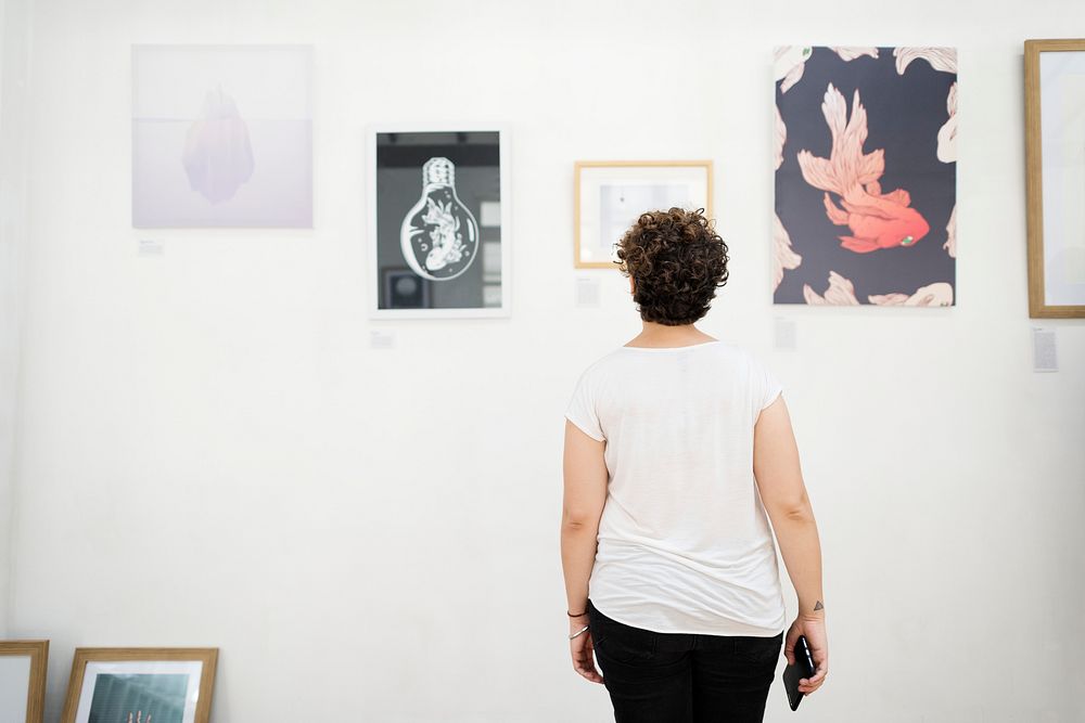 A woman is joining an art exhibition