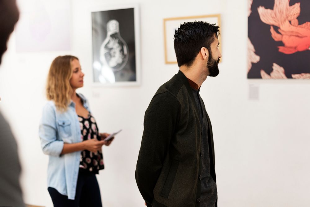 People attending an art exhibition
